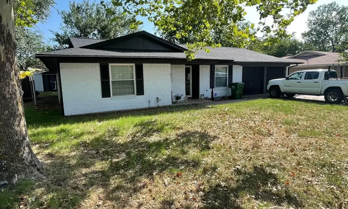 Professional roofing crew working on a residential roof in North Huntingdon